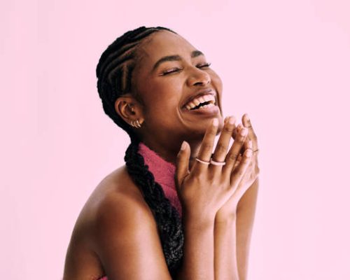 beauty shot of  beautiful black woman in monochromatic pink.. Stock photo, copy space